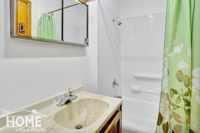 bathroom featuring vanity and shower / bath combination with curtain