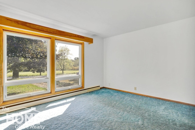 carpeted empty room featuring baseboard heating