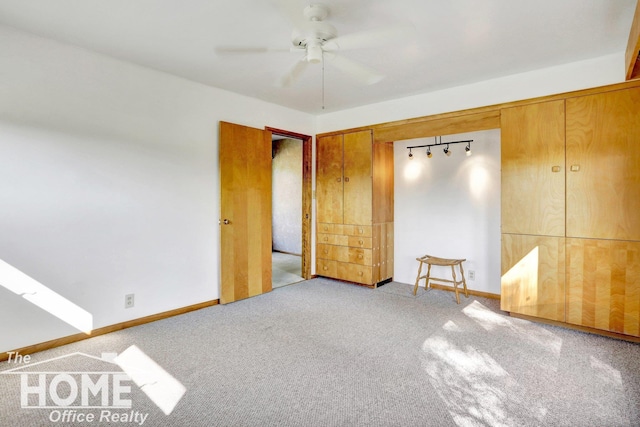 unfurnished bedroom featuring light carpet