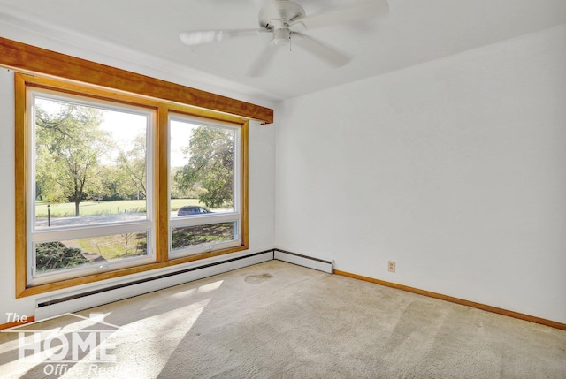 unfurnished room featuring baseboard heating, baseboards, carpet, and a ceiling fan