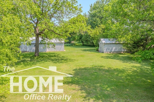 8102 Britton Rd, Perry, MI 48872 - view of green lawn with a storage shed