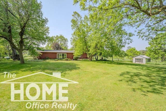 8102 Britton Rd, Perry, MI 48872 - view of grassy yard with an outbuilding