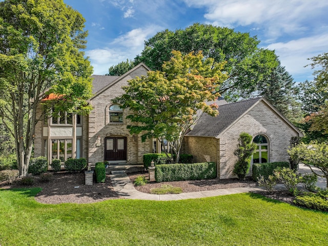 view of front of property featuring french doors and a front yard