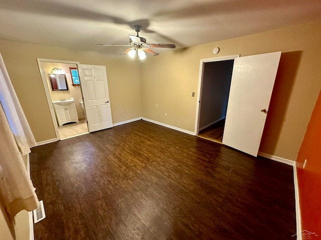 unfurnished bedroom with ensuite bath, ceiling fan, and hardwood / wood-style flooring