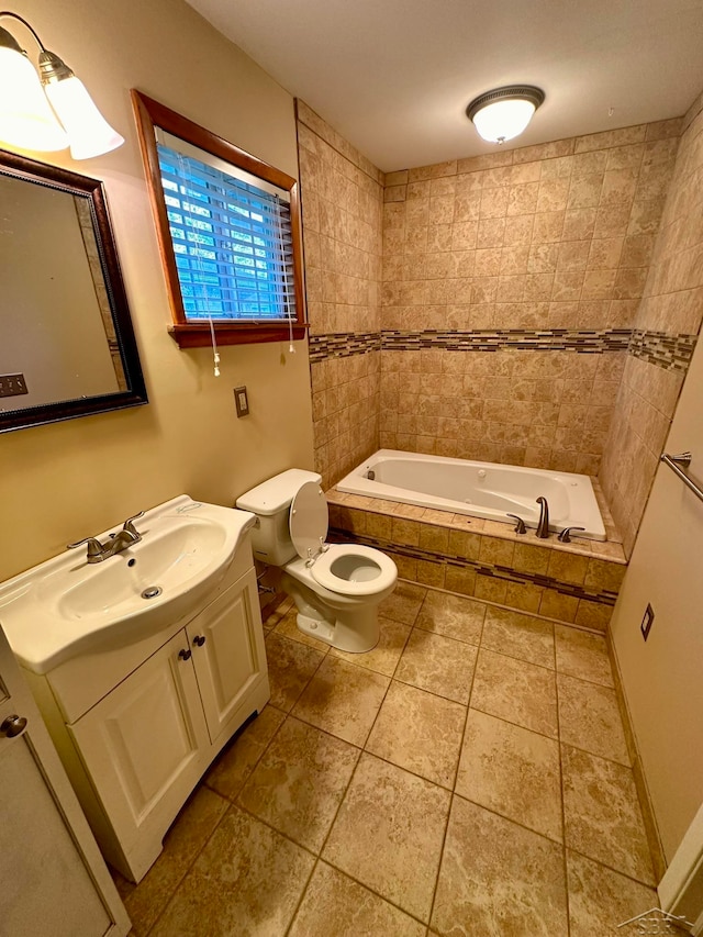 bathroom with vanity, a relaxing tiled tub, and toilet