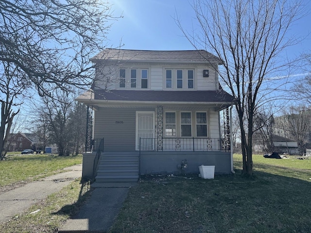 view of front of home featuring covered porch and a front yard