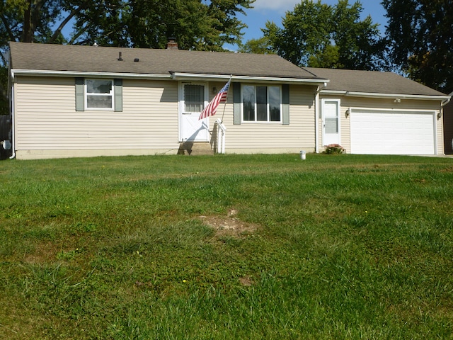 ranch-style home with a front lawn and a garage