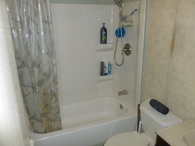 full bathroom with vanity, toilet, and shower / bath combo with shower curtain