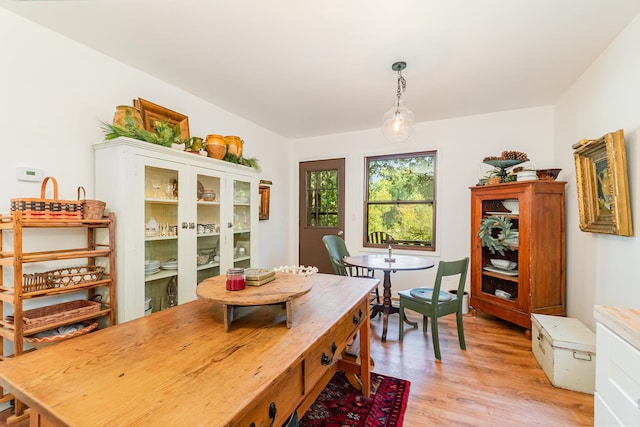 dining area with light hardwood / wood-style floors