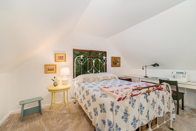 bedroom with light colored carpet and vaulted ceiling