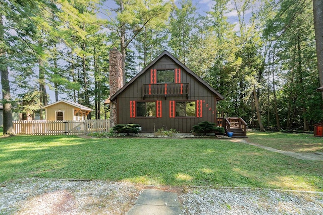 4281 Franklin Trl, Sterling, MI 48659 - view of front of home with a deck and a chimney