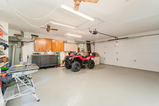 garage featuring a garage door opener and ceiling fan