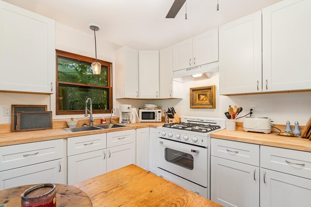 4281 Franklin Trl, Sterling, MI 48659 - kitchen with white appliances, butcher block counters, a sink, under cabinet range hood, and ceiling fan