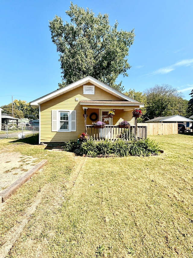 bungalow featuring a porch and a front yard