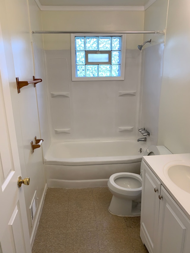 full bathroom featuring bathing tub / shower combination, tile patterned floors, toilet, vanity, and ornamental molding