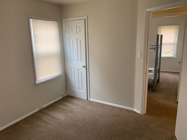 unfurnished bedroom featuring carpet floors