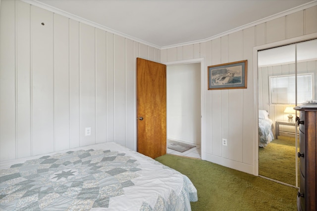 carpeted bedroom featuring wooden walls, a closet, and ornamental molding