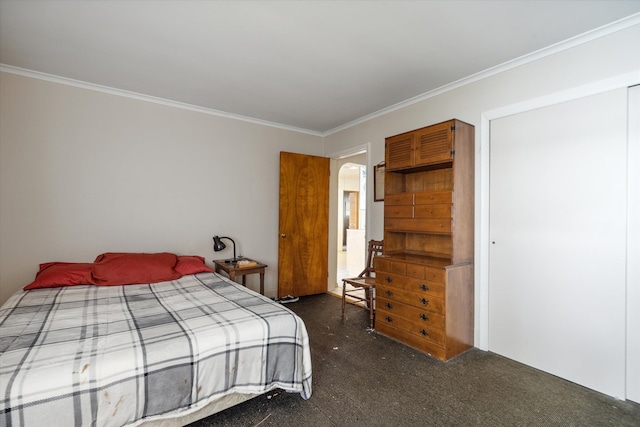 bedroom with dark colored carpet and crown molding