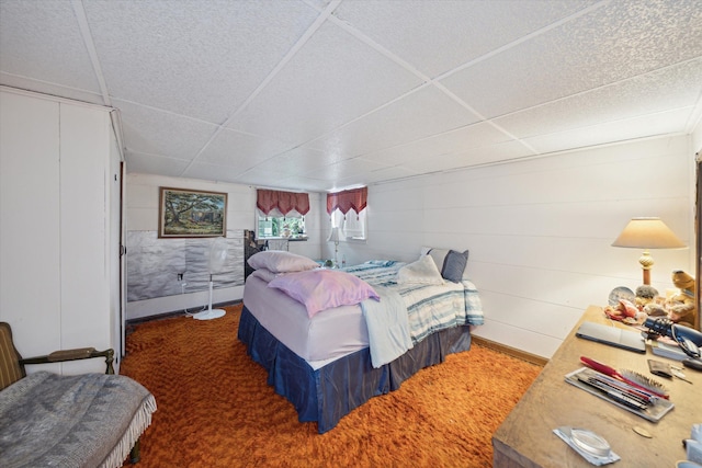 bedroom featuring dark carpet