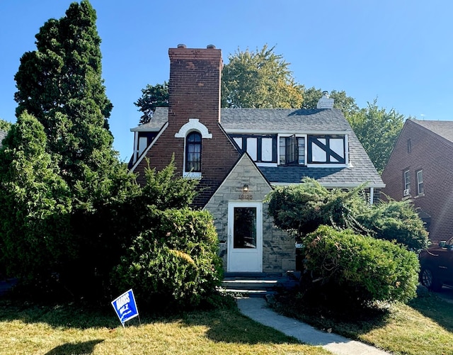 tudor house with a front lawn