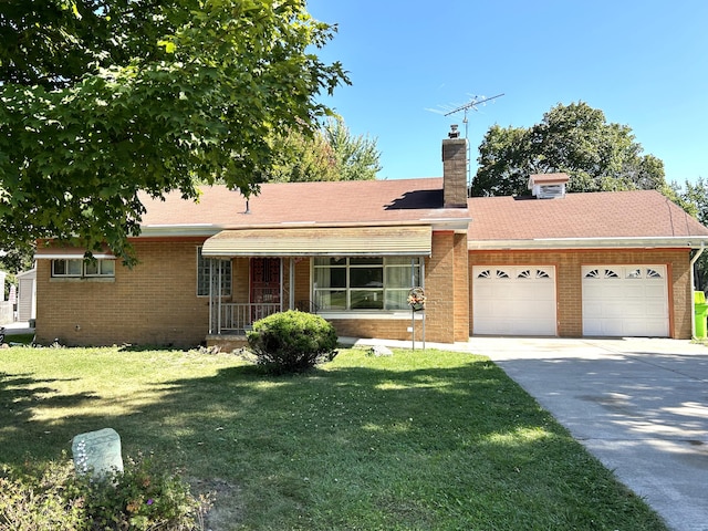 ranch-style house with covered porch, a garage, and a front yard