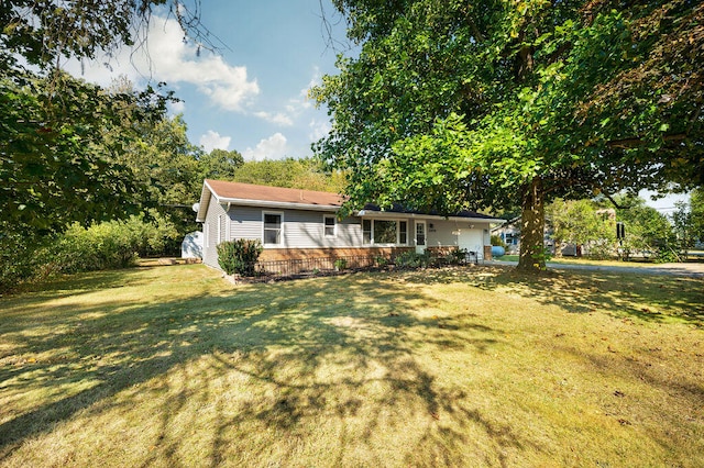 ranch-style home with a front lawn