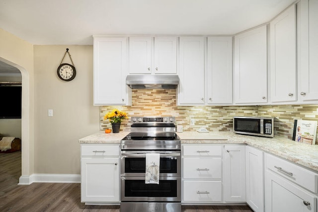 kitchen featuring white cabinets, dark hardwood / wood-style floors, backsplash, and appliances with stainless steel finishes