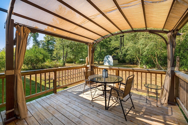 wooden deck featuring a shed