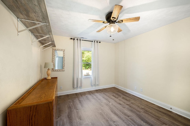 spare room with hardwood / wood-style flooring and ceiling fan