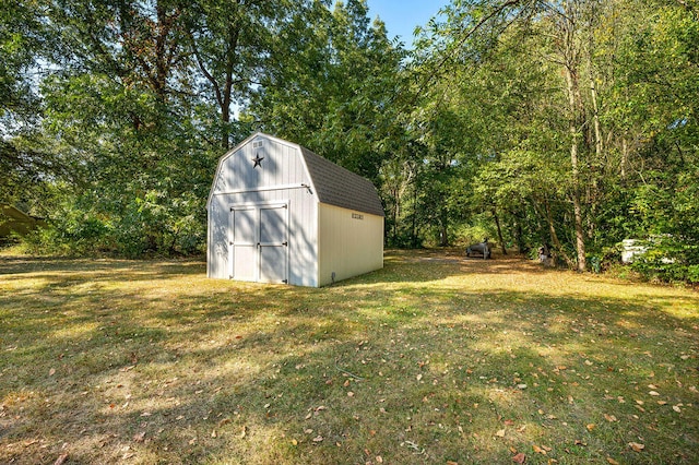 view of outbuilding featuring a lawn