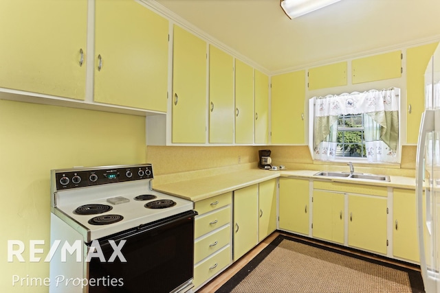 kitchen featuring electric range and sink