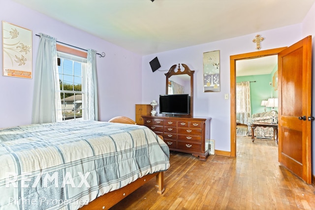 bedroom with wood-type flooring