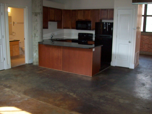 kitchen featuring kitchen peninsula, sink, and black appliances