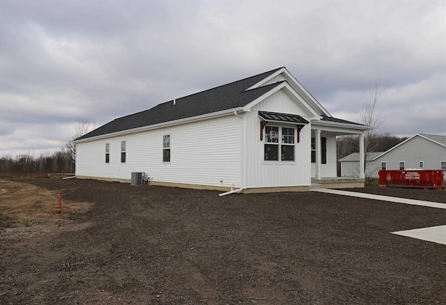 view of side of home with cooling unit