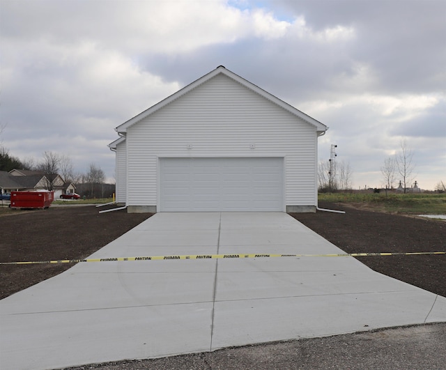 view of side of home featuring a garage