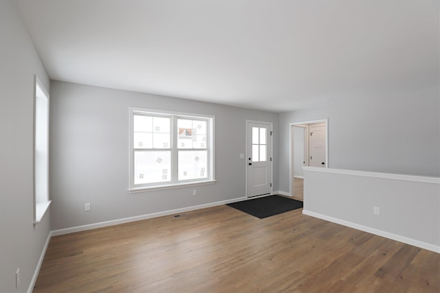 entryway with wood-type flooring