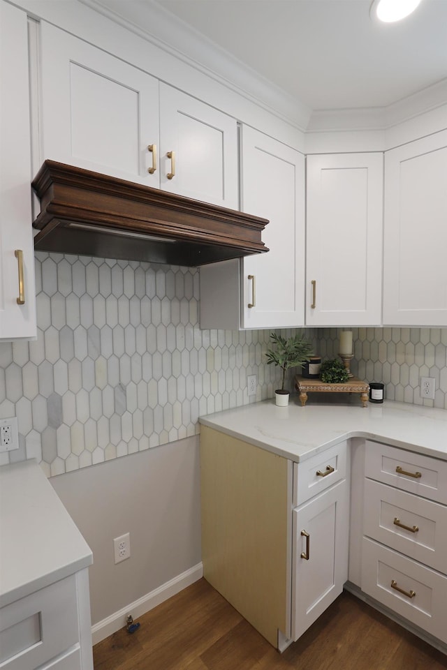 kitchen featuring decorative backsplash, dark hardwood / wood-style flooring, custom range hood, and white cabinets