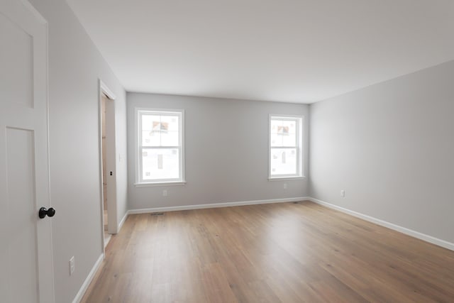 unfurnished room featuring light hardwood / wood-style flooring