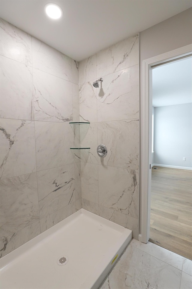 bathroom with tiled shower