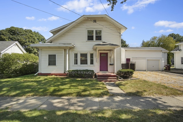 view of front of property with a garage and a front lawn