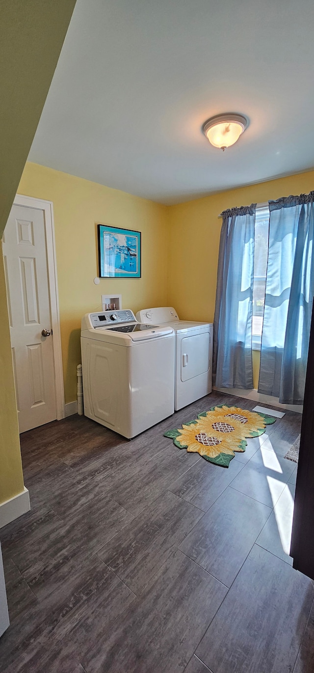 washroom featuring dark hardwood / wood-style flooring and independent washer and dryer