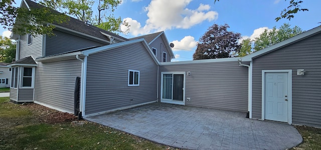 rear view of house featuring a patio