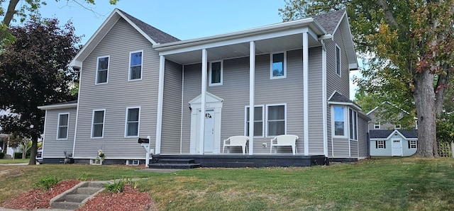 view of front of house featuring a porch and a front lawn