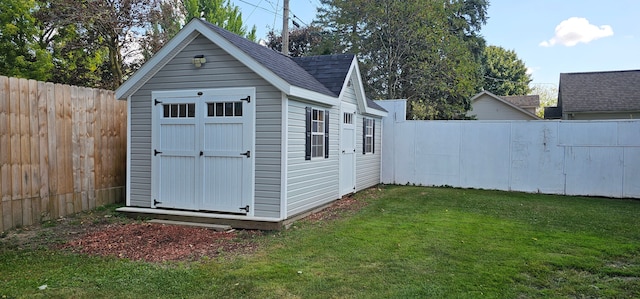 view of outdoor structure with a lawn