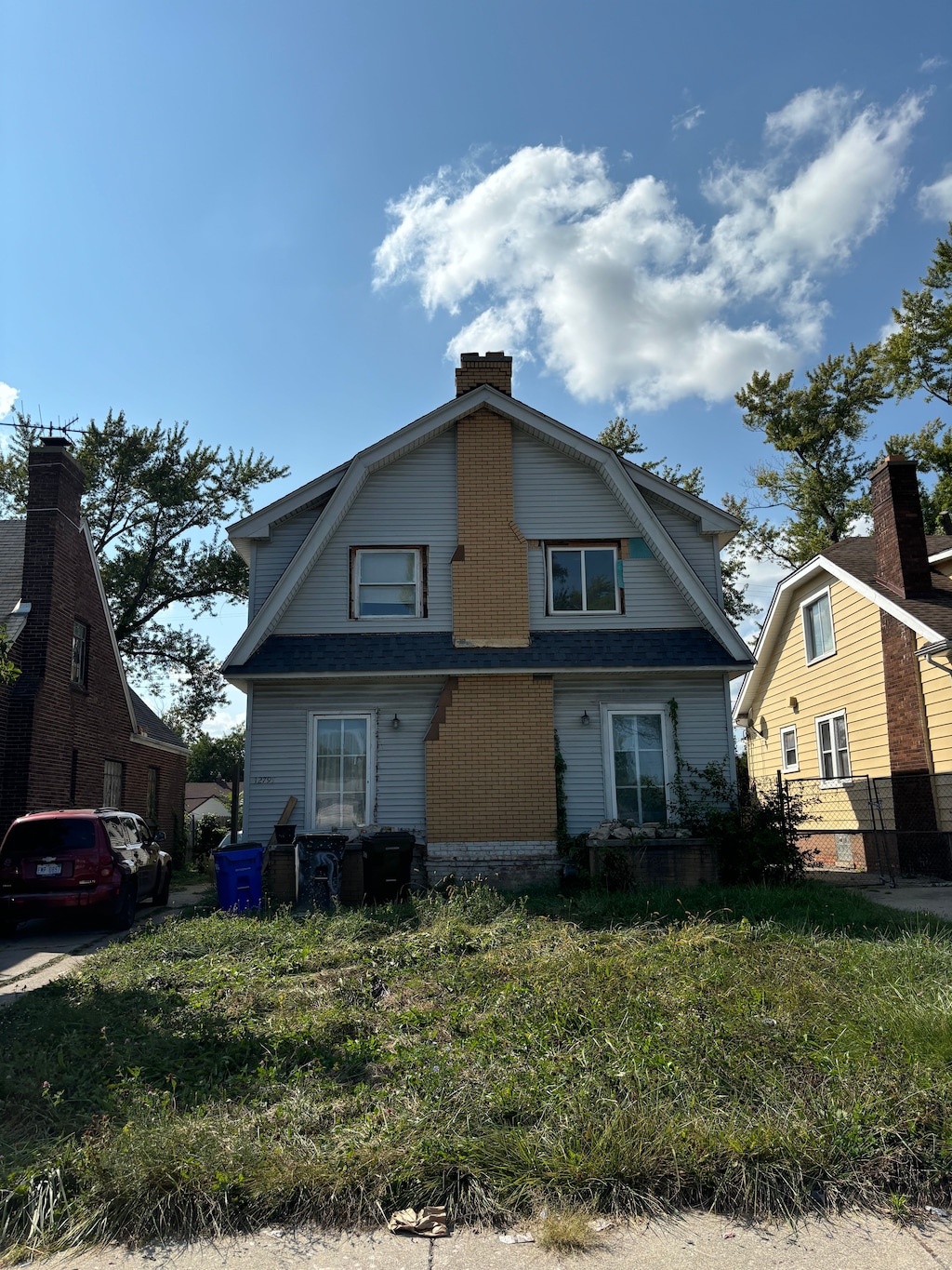 12795 Hubbell St, Detroit, MI 48227 - dutch colonial with a gambrel roof, a chimney, and a shingled roof