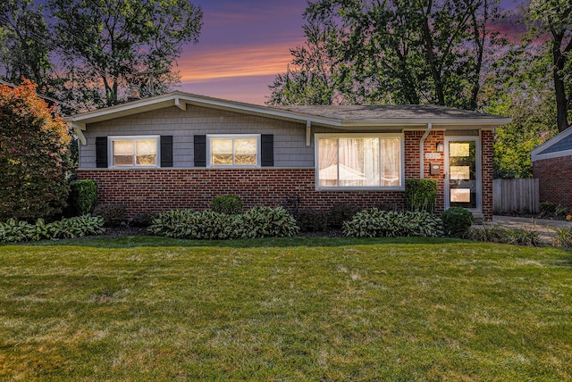 view of front of property with a yard