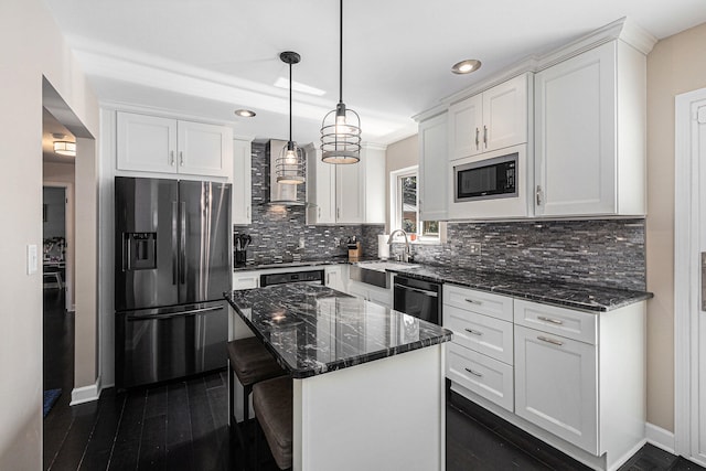 kitchen featuring white cabinetry, a center island, sink, wall chimney range hood, and black appliances