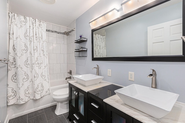 full bathroom featuring shower / tub combo, vanity, toilet, and tile patterned floors