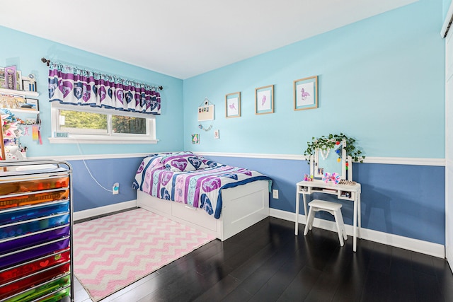 bedroom featuring dark wood-type flooring