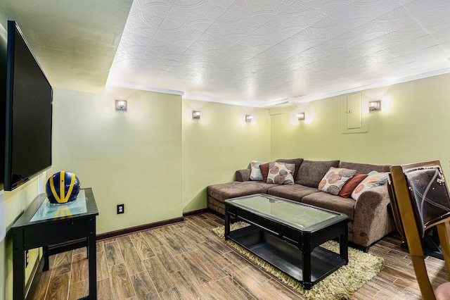 living room with hardwood / wood-style floors and ornamental molding